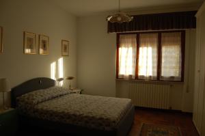 Postel nebo postele na pokoji v ubytování La casa di Beppe