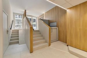 a staircase in a house with a stair case at Atalanta 0303 b2 2ev in Wenduine