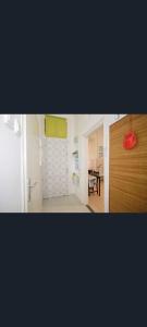 a room with a door and a kitchen with a table at FREE GARAGE! Downtown apartment, near to Andrássy avenue in Budapest