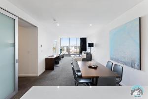 a conference room with a table and chairs and a view at 2 beds luxury apartment in the heart of chatswood12 in Sydney