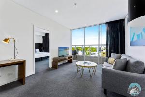 a living room with a couch and a table at 2 beds luxury apartment in the heart of chatswood12 in Sydney