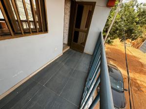 a stairway leading to a door of a house at Prestige House in Ouagadougou