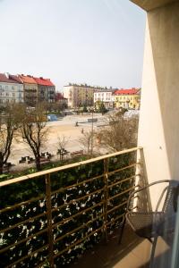 a balcony with a view of a parking lot at Apartament Rynek 10 in Ostrowiec Świętokrzyski