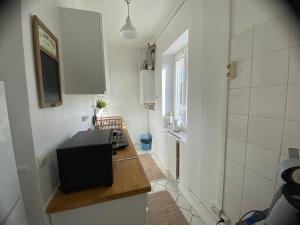 Μια τηλεόραση ή/και κέντρο ψυχαγωγίας στο Appartement quatre couchages, 100 m plage