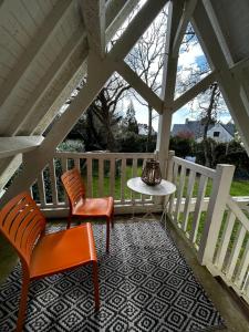 two chairs and a table on a porch at Cottage Guerande in Guérande
