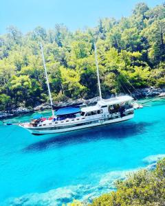 a boat floating in the water in a river at Lusaas Yacht in Kas