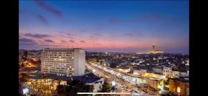 a view of a city at night with a building at اقامة الهام in Casablanca