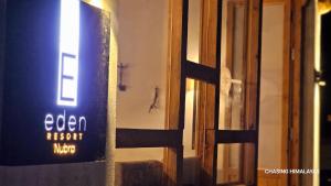 a sign that reads open next to a door at Eden Resort Nubra in Hundar