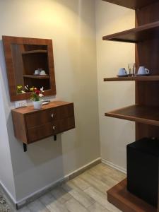 a room with a dresser and a mirror on a wall at Casablanca Hotel in Cairo