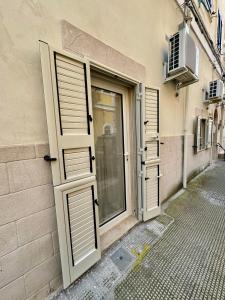 an open door on the side of a building at Casa Celeste in Monopoli