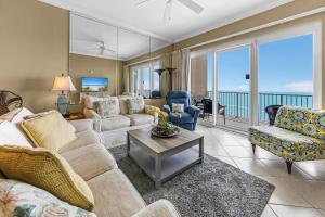 a living room with a couch and chairs at Grandview East 1503 in Panama City Beach