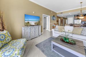 a living room with a couch and a table at Grandview East 1503 in Panama City Beach