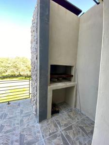 a room with a fireplace in a wall at Morningside Village in Ongwediva