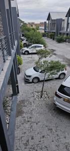 a group of cars parked in a parking lot at Morningside41 in Ongwediva