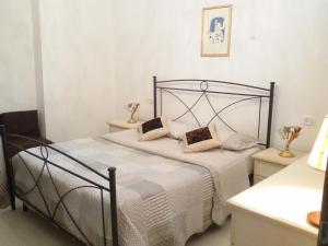 Postel nebo postele na pokoji v ubytování La Tavernetta