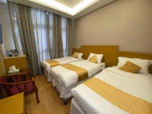 En eller flere senger på et rom på فندق أوركيد العزيزية توصيل للحرم