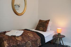 Katil atau katil-katil dalam bilik di Milling Hotel Saxildhus