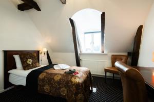 Katil atau katil-katil dalam bilik di Milling Hotel Saxildhus