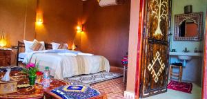 Postel nebo postele na pokoji v ubytování Oasis Tilogui - Luxury hotel in Zagora