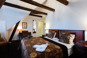 Katil atau katil-katil dalam bilik di Milling Hotel Saxildhus