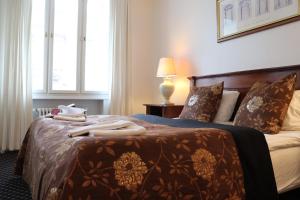 Katil atau katil-katil dalam bilik di Milling Hotel Saxildhus