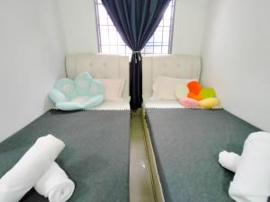 Кровать или кровати в номере Rimba Section 9 - Double Storey by Manhattan Group