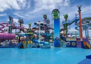 a large water park with a water slide at Constancy Pattaya Hotel Jomtien in Na Jomtien