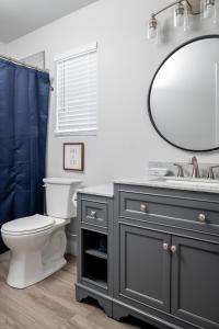 a bathroom with a sink and a mirror at Garofalo Cottage at Wrenwood Ranch, King Bed in Johnson City