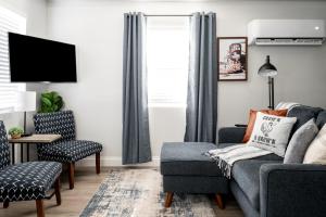 a living room with a couch and a chair at Garofalo Cottage at Wrenwood Ranch, King Bed in Johnson City