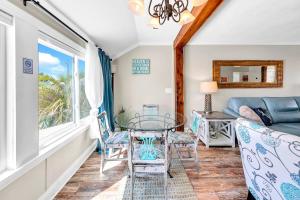a living room with a couch and a table at Misty Harbour 7 in Panama City Beach