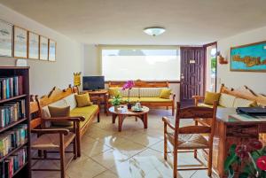 a living room with couches and a table at Matzi Hotel Apartments in Gerani