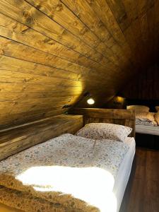 Postel nebo postele na pokoji v ubytování Apartmány Vlachovice