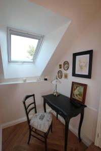 a room with a table and a chair and a window at Domaine de Champouteau - Gîtes et Chambres d'hôtes in Averdon +98 photos