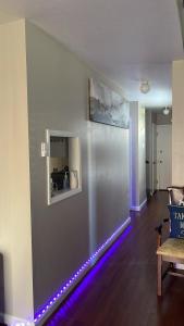 a living room with a led strip on the wall at Private Master Bedroom in Santa Clara