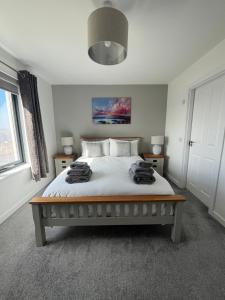 A bed or beds in a room at Sgothan Dearg