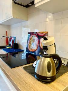 a kitchen with a coffee maker on a counter at Very nice cosy new appart in Ostwald