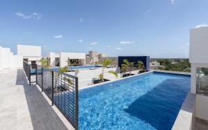 a swimming pool on the roof of a building at 2BD with Rooftop Pool near Beach in Tulum