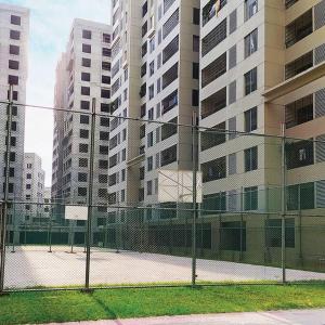 a chain link fence in front of tall buildings at Aayan Palace, Sector #15, Mirpur, Dhaka in Dhaka