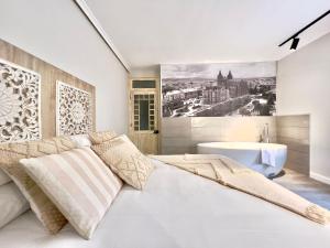 Postel nebo postele na pokoji v ubytování Apartamentos Turísticos Juego de Cañas