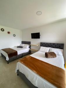 Postel nebo postele na pokoji v ubytování CASONA HOTEL LA DIVISA