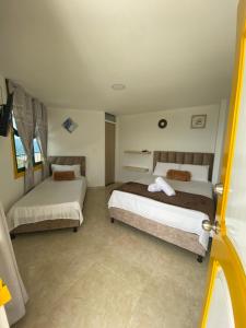Postel nebo postele na pokoji v ubytování CASONA HOTEL LA DIVISA