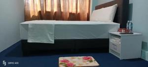 Postel nebo postele na pokoji v ubytování Hotel Blue Orchid