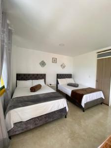 Postel nebo postele na pokoji v ubytování CASONA HOTEL LA DIVISA