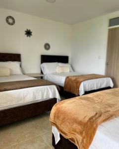 Postel nebo postele na pokoji v ubytování CASONA HOTEL LA DIVISA