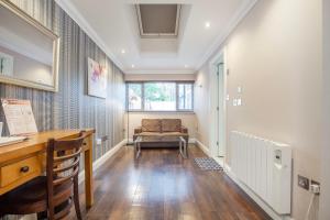 a home office with a desk and a chair at Marlborough Hotel in Norwich