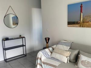 VUE MER et SOLEIL LEVANT AU BELVEDERE客房内的一张或多张床位