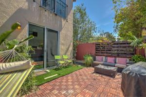 a patio with a couch and a bench in a yard at Three Story Spanish Style 3 Story Home in SD best location in San Diego