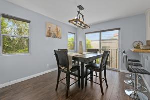 a dining room with a table and chairs at Three Story Spanish Style 3 Story Home in SD best location in San Diego