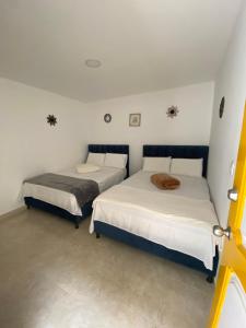 Postel nebo postele na pokoji v ubytování CASONA HOTEL LA DIVISA