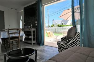 Posedenie v ubytovaní Maison rénovée avec Wifi, jardin, à 450m du centre de PERROS-GUIREC - Réf 924